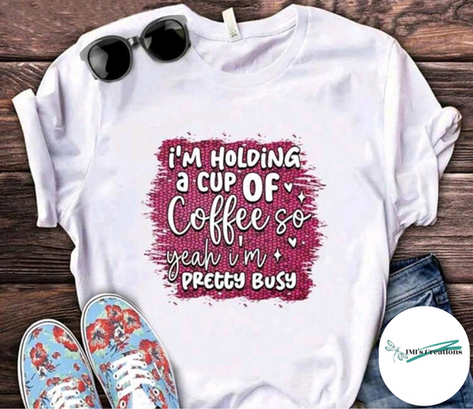 I am holding a cup of coffee